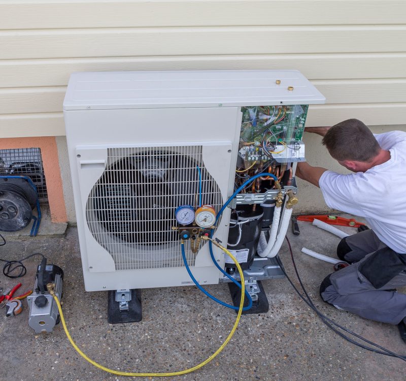 plumber at work installing a circulation pump